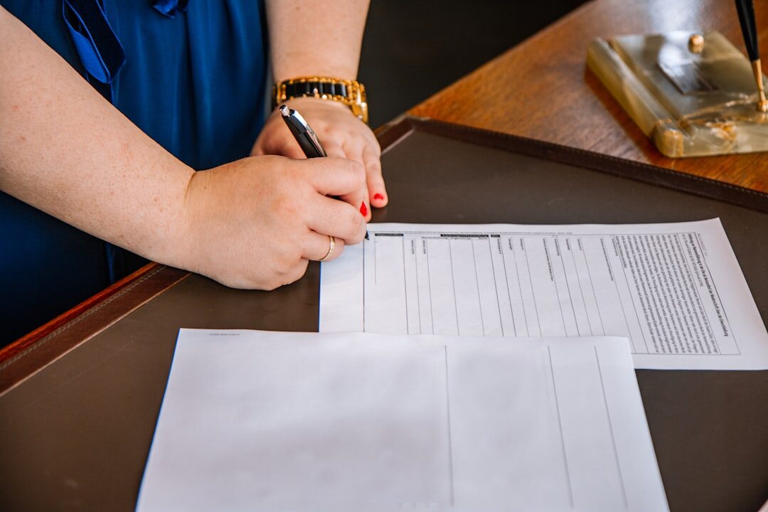 person reviewing car insurance papers